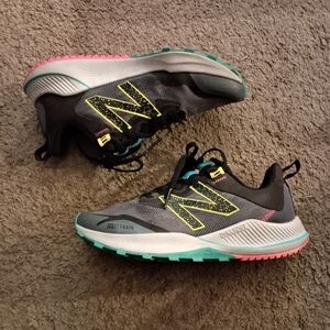 New Balance Gray Trail Sneakers with Teal and Pink Accents